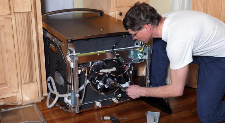 Technician repairing appliance