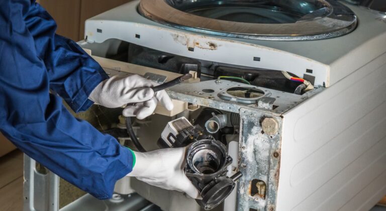 Technician repairing appliance